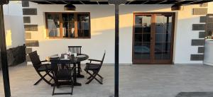 big-playa-blanca-villa-villa-arabella-outside-dining-area-view-from-other-side-of-pool