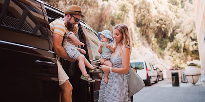 Family getting out of car