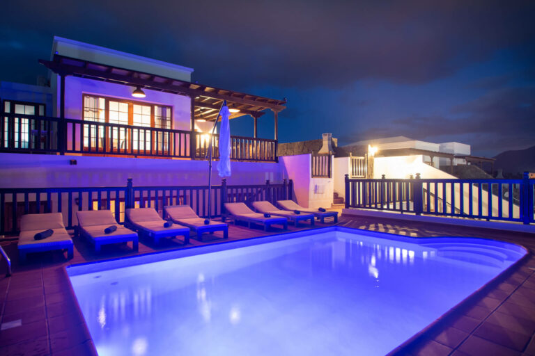 Playa blanca villa vista rey swimming pool night
