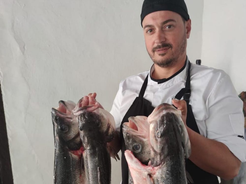 La Bodega De Santiago restaurant chef with fish